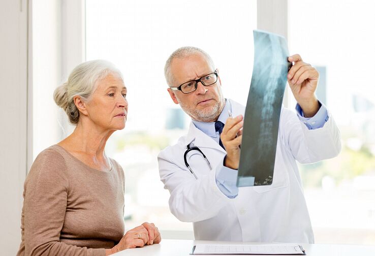 Doctor identifies cervical osteonecrosis in a patient using X-rays